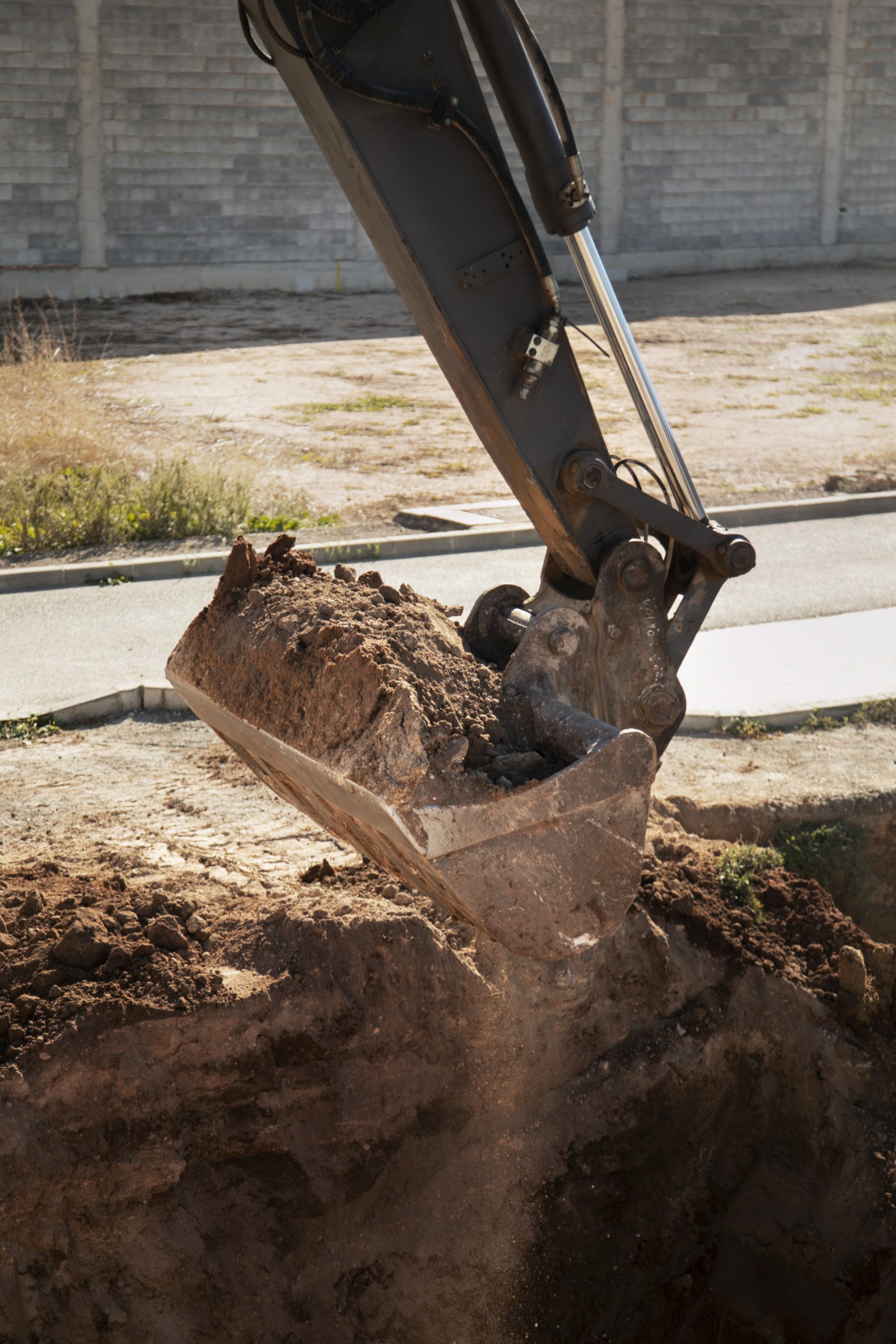 heavy-excavator-digging-day-light-outdoors-min